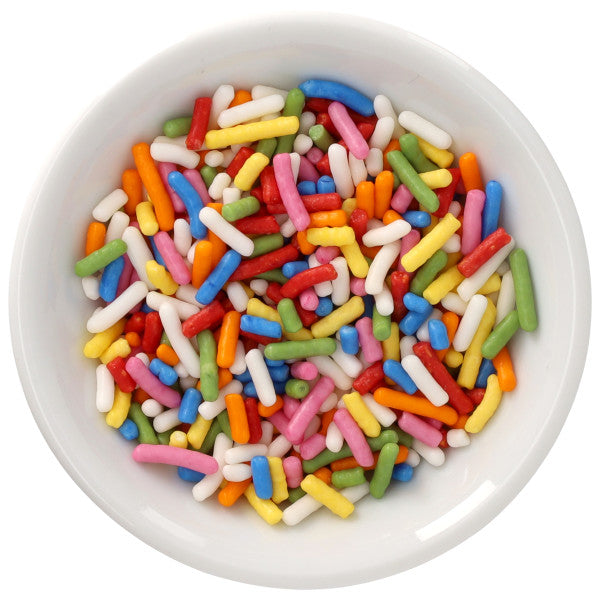 White bowl filled with Bright Rainbow Natural Dyed Made Simply™ rod-shaped sprinkles in red, blue, green, yellow, orange, pink, and white.
