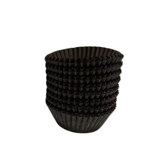 Stack of brown fluted paper candy cups with tight accordion folds, shown on a white background.