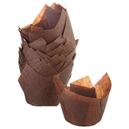Stack of brown tulip baking cups with tall folded paper petals, shown with one brown liner opened in front on a white background.