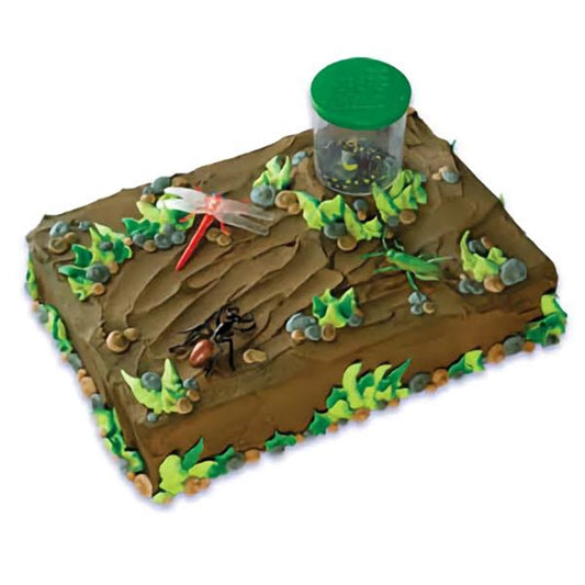 A bug collecting themed rectangular cake resembling a forest floor, with textured chocolate icing to mimic bark. This cake is cleverly topped with a green bug catching jar, dragonflies, and rocks, interspersed with vibrant green leaves. It’s a perfect centerpiece for a young entomologist's birthday or a whimsical woodland-themed event.