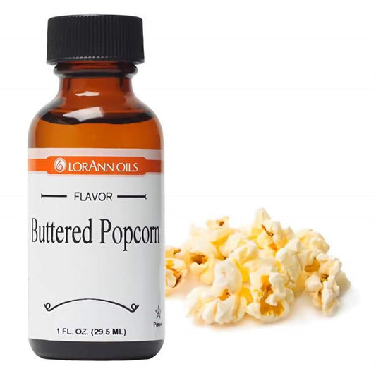 1 fl oz bottle of LorAnn Oils Buttered Popcorn Flavor, positioned next to a handful of freshly popped buttery popcorn, evoking a favorite movie-time snack.