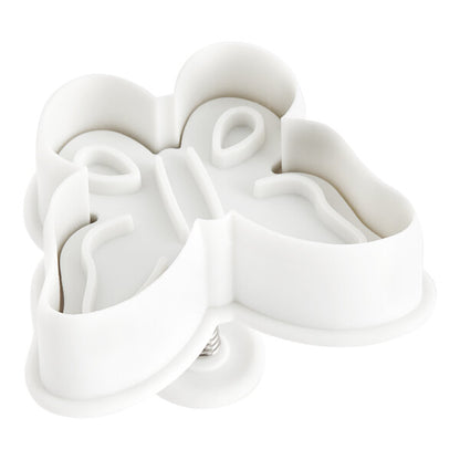 Impression side of White butterfly-shaped plunger cookie cutter on a white background