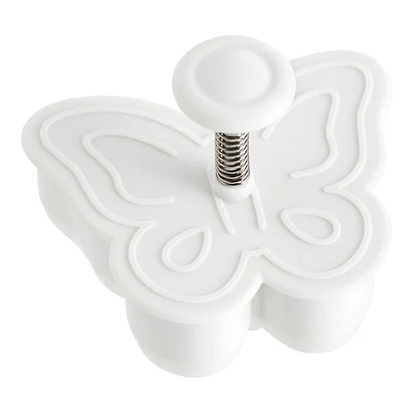 White butterfly-shaped plunger cookie cutter on a white background