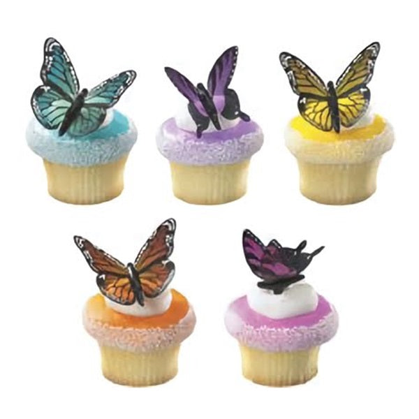 A playful collection of cupcakes, each crowned with a different colored frosting - blue, purple, yellow, and pink. Resting atop each cupcake is a beautifully crafted butterfly with detailed wings, in coordinating hues that bring a pop of color and joy to any dessert table, ideal for birthday celebrations or a spring garden party.