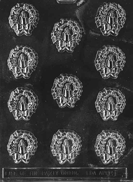 Clear chocolate mold with small wreath and candle motif cavities, about 1 3/4 by 1 1/2 by 3/8 inch; C004