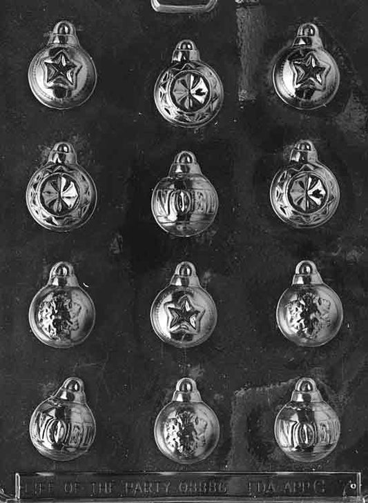Clear plastic mold featuring multiple small ornament bulb cavities, about 1 3/4 by 1 1/4 inches; C007
