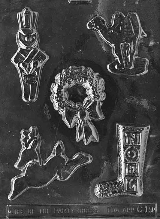Clear mold sheet with assorted Christmas shapes including a stocking; largest cavity about 4 by 2 5/8 by 1/4 inch; C019