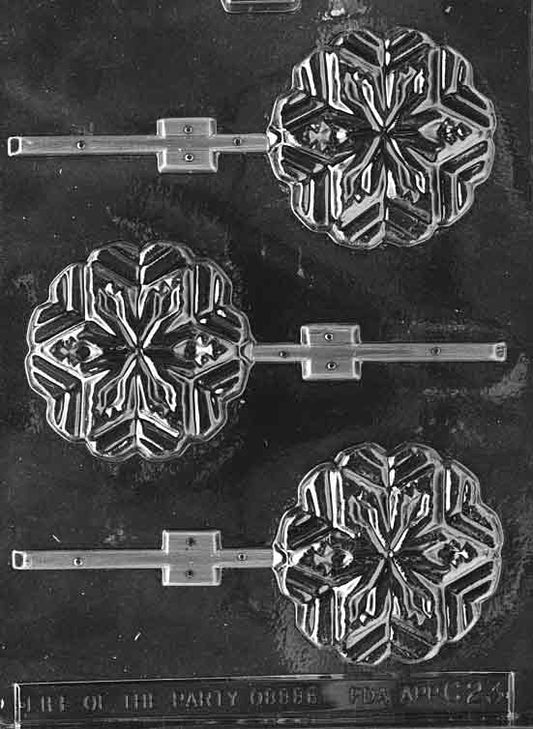 Clear round snowflake lollipop mold with crisp geometric flake detail; approx. 3 inches diameter, 3/8 inch deep; C023