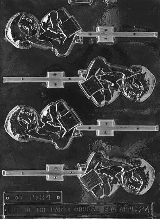 Clear lollipop mold of a traditional drummer boy figure; approx. 3 1/2 by 2 1/4 by 1/4 inch; C024