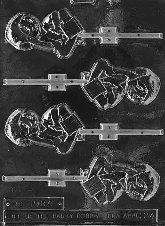 Clear lollipop mold of a traditional drummer boy figure; approx. 3 1/2 by 2 1/4 by 1/4 inch; C024