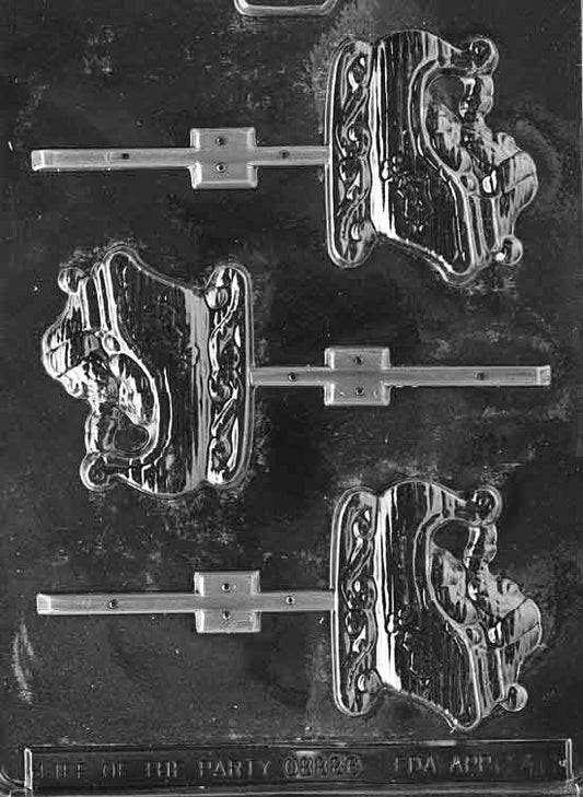 Clear lollipop mold shaped like a classic Christmas sleigh with curved runners and tall back; approx. 2.5 × 3 × 3/8 in; C046