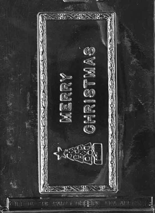 Long rectangular bar mold with “Merry Christmas” message in relief; approx. 7 × 3 × 1/2 in; C066