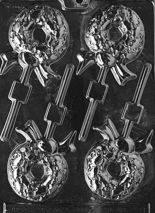 Image of WREATH Lollipop mold with a circular wreath featuring a bow and textured greenery pattern