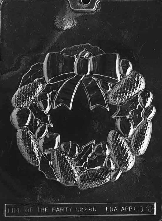 Image of large wreath-shaped mold with open center and smooth area suitable for writing or decorating