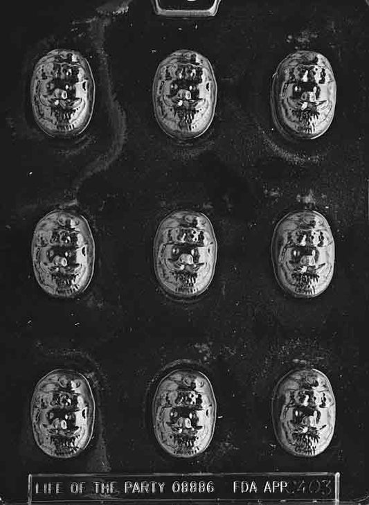 Small chocolate mold with smiling Santa face for bon bons