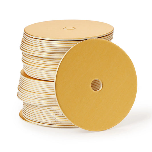 Stack of champagne-colored cake pop boards with straight edges and a satin finish, each featuring a center hole, shown with one board facing forward.