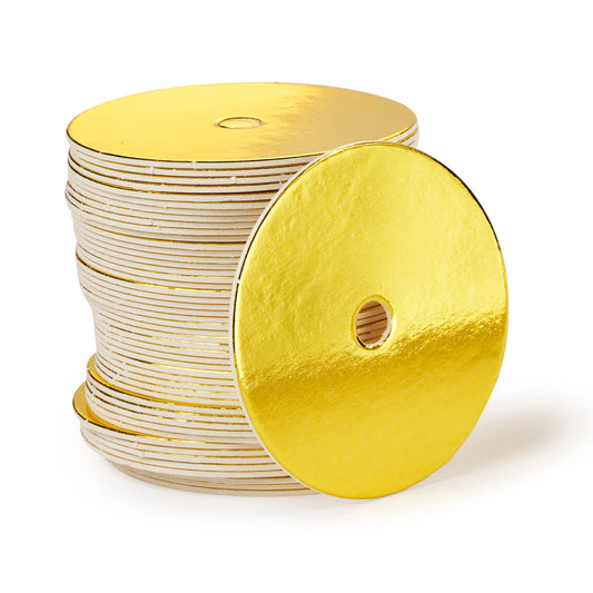 Stack of shiny gold round cake pop boards with straight edges and center hole for cake pop sticks or decorative straws.
