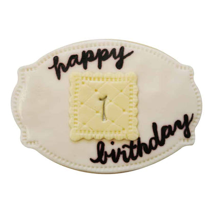 Decorated sugar cookie made with the Cameo Plaque cutter, featuring a birthday theme with fondant details.