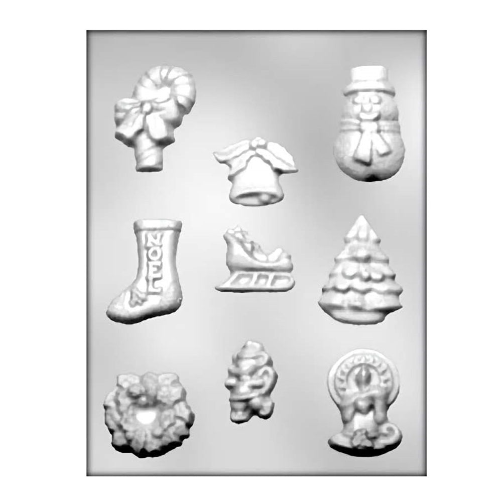 Chocolate mold featuring a festive assortment of Christmas shapes including candy canes with bows, stockings with 'Noel' text, sleighs, Christmas trees, snowmen with hats, wreaths, and nutcrackers, perfect for creating holiday-themed chocolates and decorations.