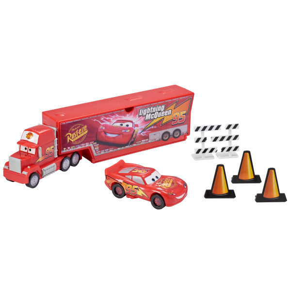 Disney and Pixar's Cars Signature DecoSet® featuring Mack with a built-in launcher, Lightning McQueen, break-apart traffic barriers, cones, and a fence.