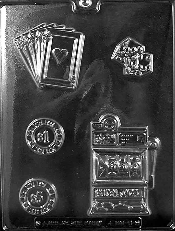 Clear plastic chocolate mold sheet with casino-themed cavities including a slot machine, a stack of playing cards with a heart, dice, and round poker chips.