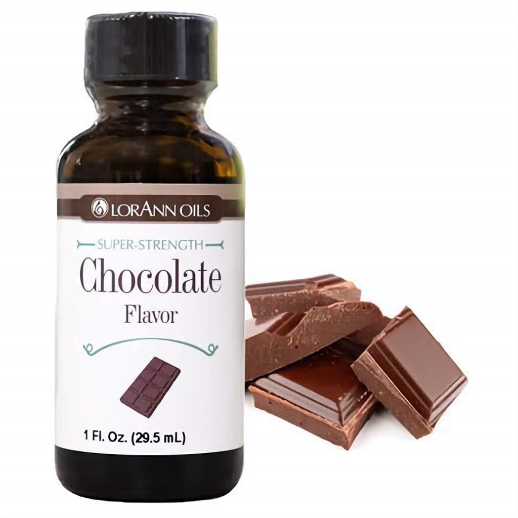 1 fl oz bottle of LorAnn Oils Super Strength Chocolate Flavor, placed near chunks of dark chocolate, capturing the deep and indulgent chocolate aroma.