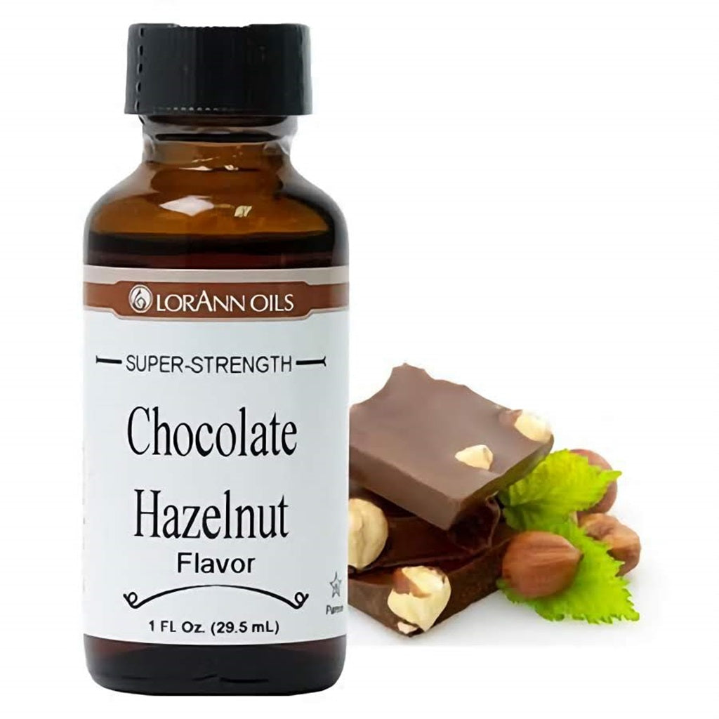 LorAnn Oils Super Strength Chocolate Hazelnut Flavor in a 1 fl oz bottle, with pieces of hazelnut chocolate bar beside it, depicting the rich, nutty taste.