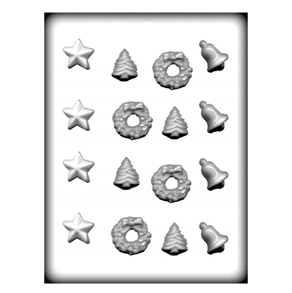 A hard candy mold featuring an assortment of christmas shapes. The included shapes are starts, christmas trees, wreaths, and bells.