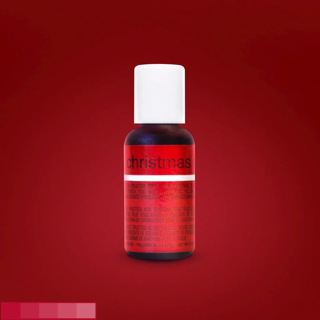 This image shows a bottle of chefmaster food coloring with a vibrant red gel, aptly named "christmas". It features a white cap with a label that has text detailing the contents, set on a background colored in a festive red shade like the gel.