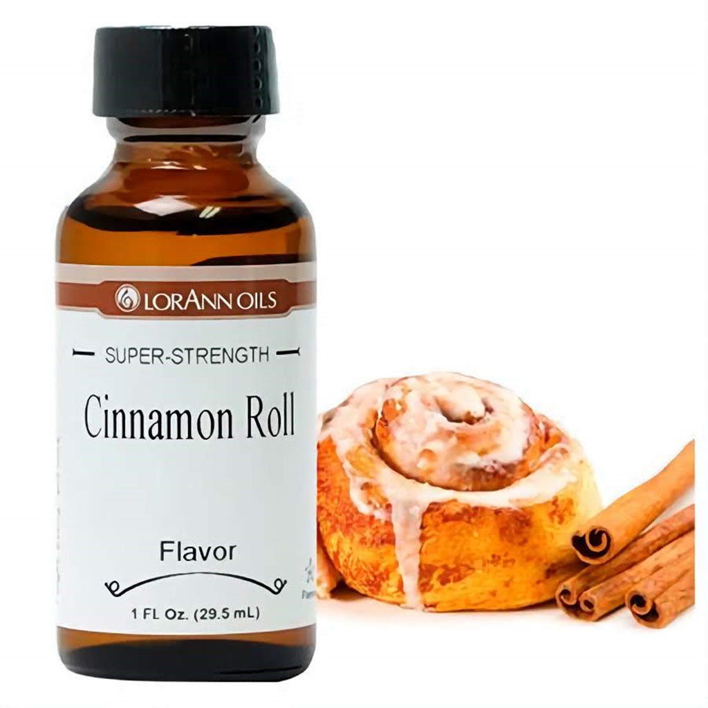 A 1 fl oz bottle of LorAnn Oils Super Strength Cinnamon Roll Flavor next to a freshly baked cinnamon roll and cinnamon sticks, representing the warm, spicy aroma.