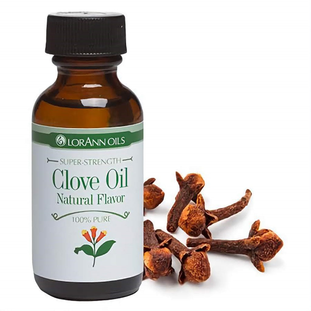 1 fl oz bottle of LorAnn Oils Super Strength Clove Oil Natural Flavor surrounded by aromatic dried cloves, conveying the intense, spicy character of the oil.