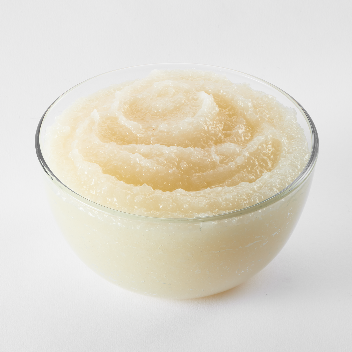 Bowl filled with smooth coconut cake and pastry filling; creamy and glossy texture