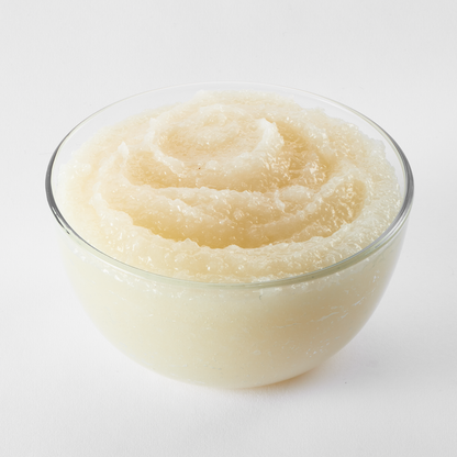 Bowl filled with smooth coconut cake and pastry filling; creamy and glossy texture