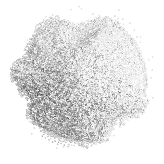 Close-up of Colour Mill white edible glitter showing a dense mound of fine reflective white and silver-toned particles on a white background.