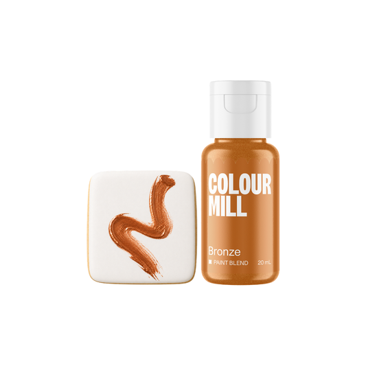 Colour Mill Bronze Metallic Paint Blend bottle beside a white square cookie decorated with a curved brushstroke of rich copper-bronze metallic edible paint.