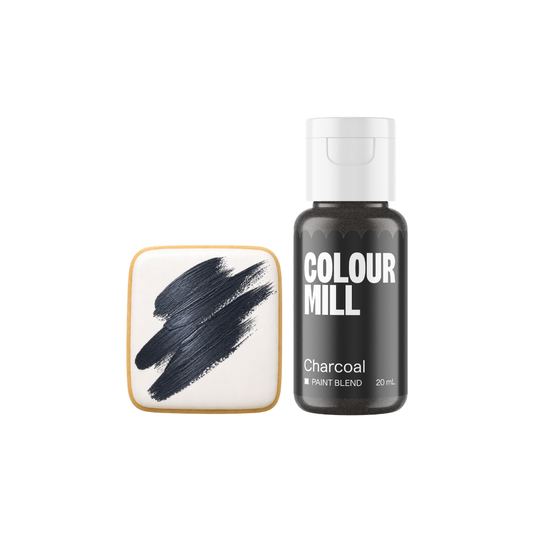 Colour Mill Charcoal Metallic Paint Blend bottle beside a white square cookie decorated with broad textured brushstrokes of dark charcoal-grey edible paint.