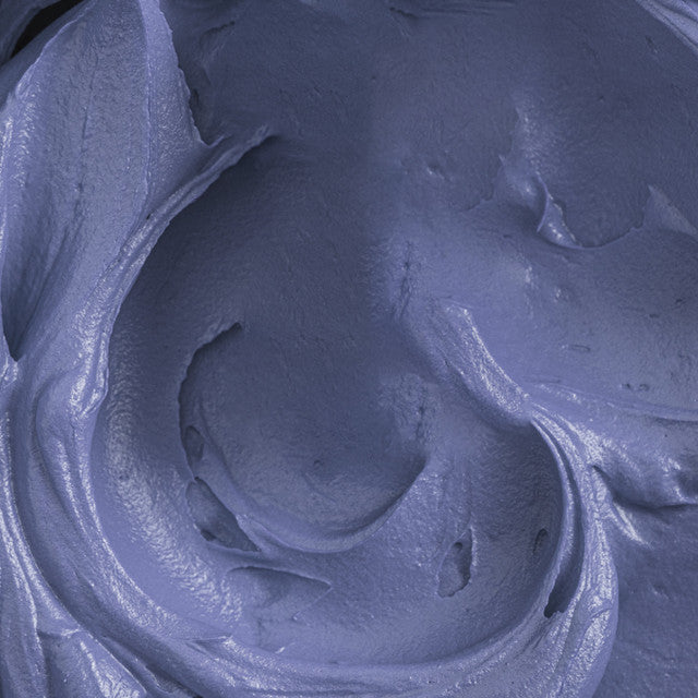 Close-up of buttercream tinted with Colour Mill Denim, showing its smooth, rich blue hue.
