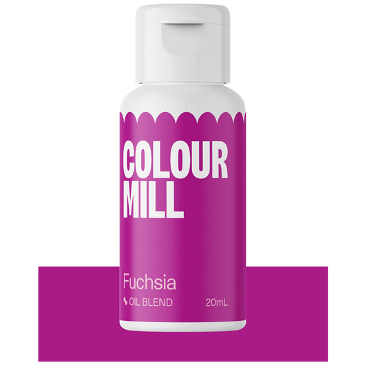 Bottle of Colour Mill Fuchsia oil blend food coloring with vibrant pink labeling.