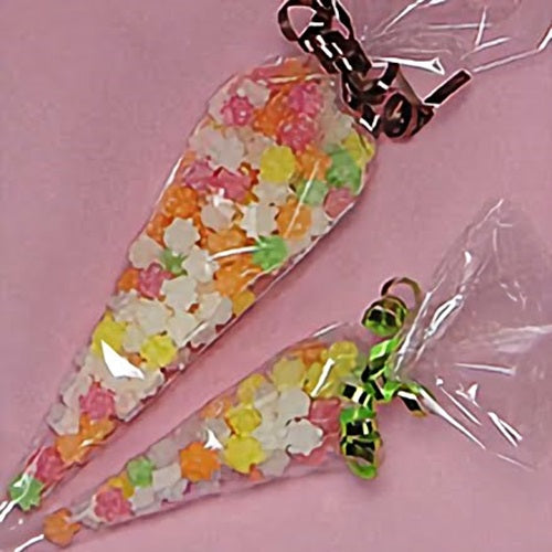 Two cone shaped cello treat bags containing candies in a variety of color. The bags are tied off with ribbon.