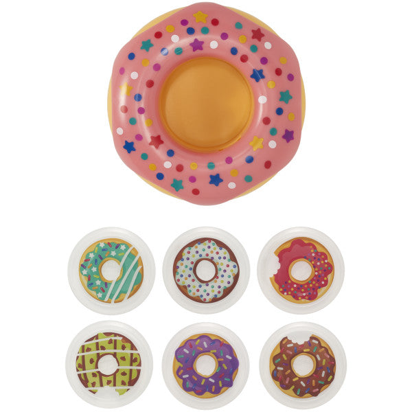 A seven-piece cake topper set featuring a large pink donut with colorful sprinkles and six small donut decorations.