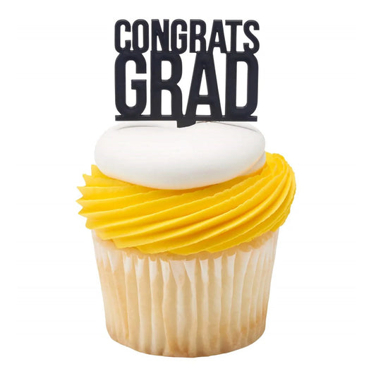 Black “CONGRATS GRAD” cupcake pick inserted into a cupcake with white frosting and a yellow swirl, shown on a white background.
