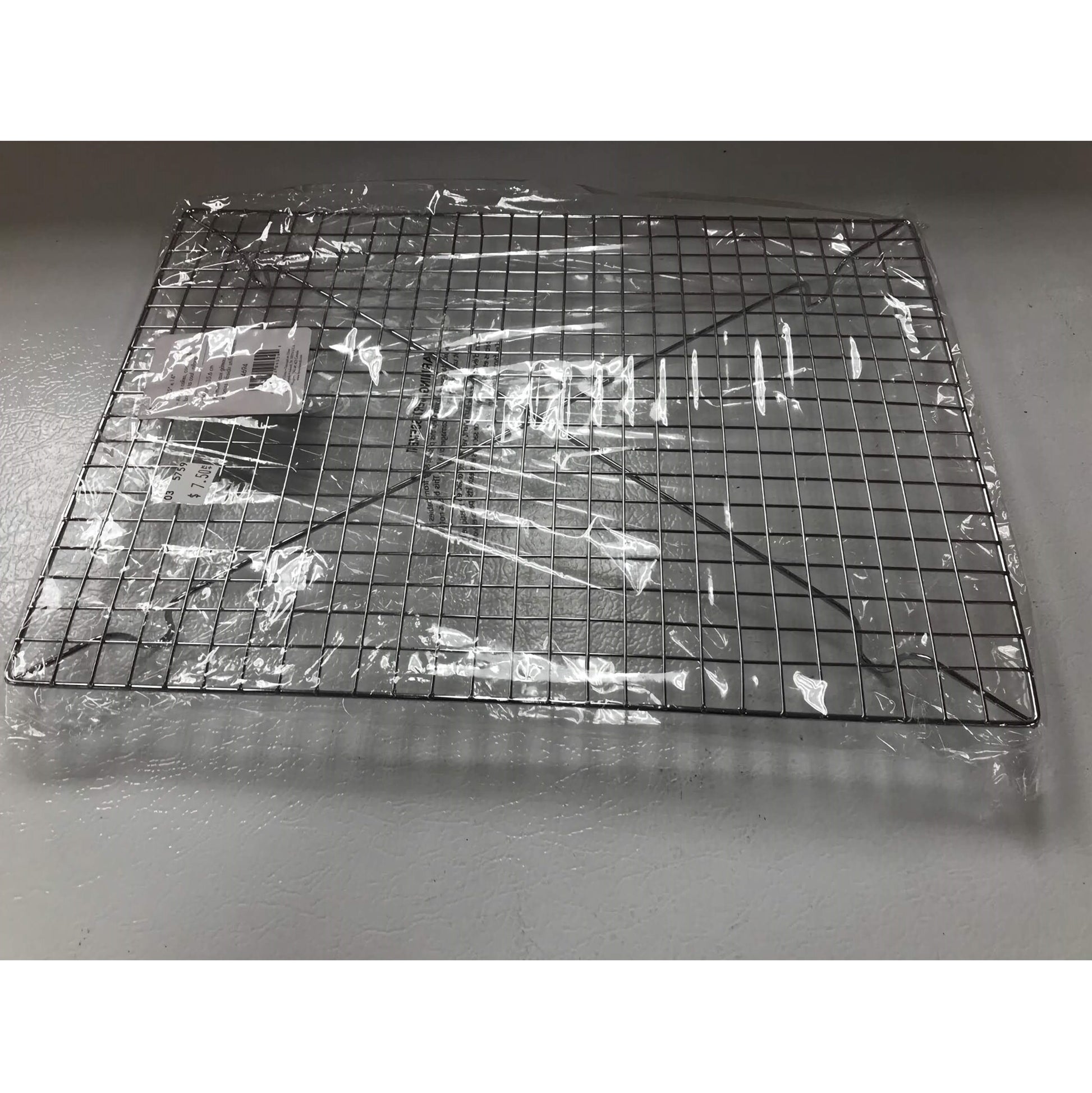 A Cooling Rack for baking wrapped in plastic