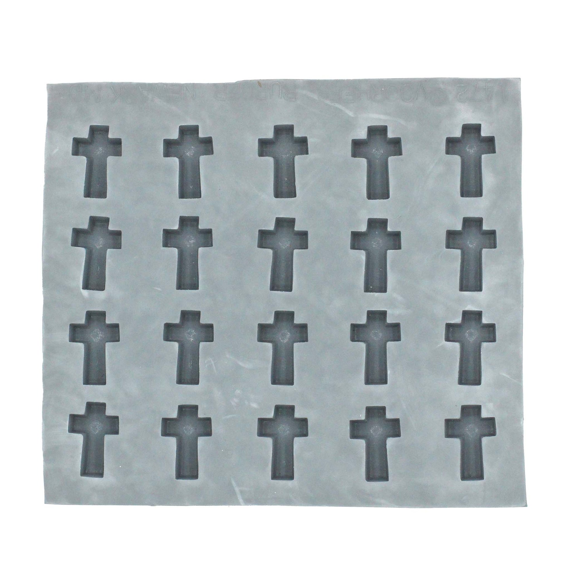 Full view of the cross rubber mint mold featuring multiple cavities for creating small, uniform religious-themed treats.