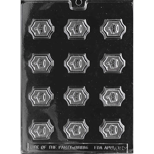 Crown Chocolate Mold with twelve cavities, each featuring a detailed crown design with a decorative border. The mold creates 1-5/8 inch by 1-1/4 inch and 1/2 inch deep chocolate pieces, using approximately 0.4 ounces of chocolate per piece. Made of food-grade plastic and manufactured in the USA.
