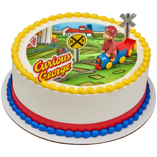 Round cake decorated with Curious George train topper and railroad signs on a printed background