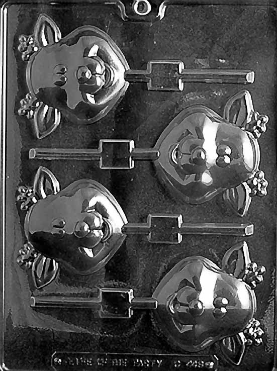 Clear lollipop mold featuring four cute reindeer faces with small antlers and round noses, each aligned with a stick channel on a glossy plastic sheet.