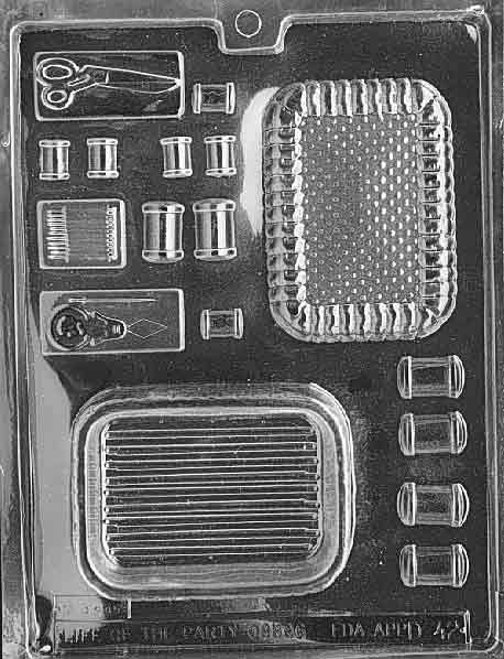 Chocolate mold featuring sewing tools and accessories