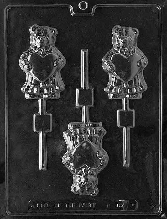 Bear-shaped chocolate mold holding a heart