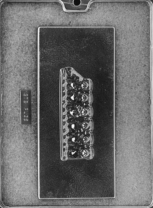 Chocolate mold with multiple pug faces arranged along a candy bar strip. Great for dog-themed chocolate bars.