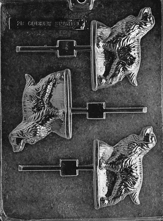 Lollipop chocolate mold of a Cocker Spaniel dog with cute features and floppy ears. Includes stick channel.